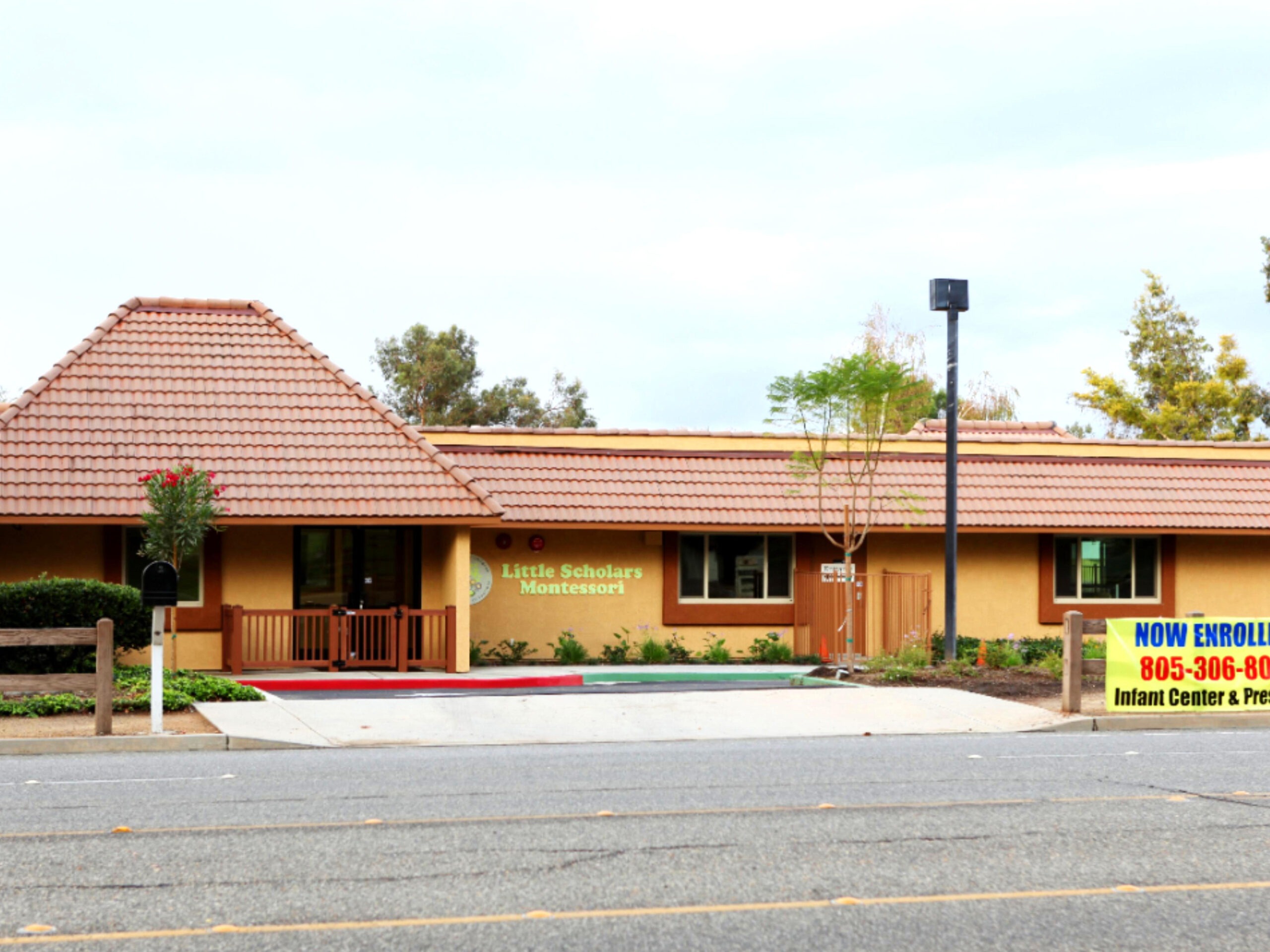A bright yellow house stands prominently against a clear blue sky, showcasing its cheerful and inviting exterior.