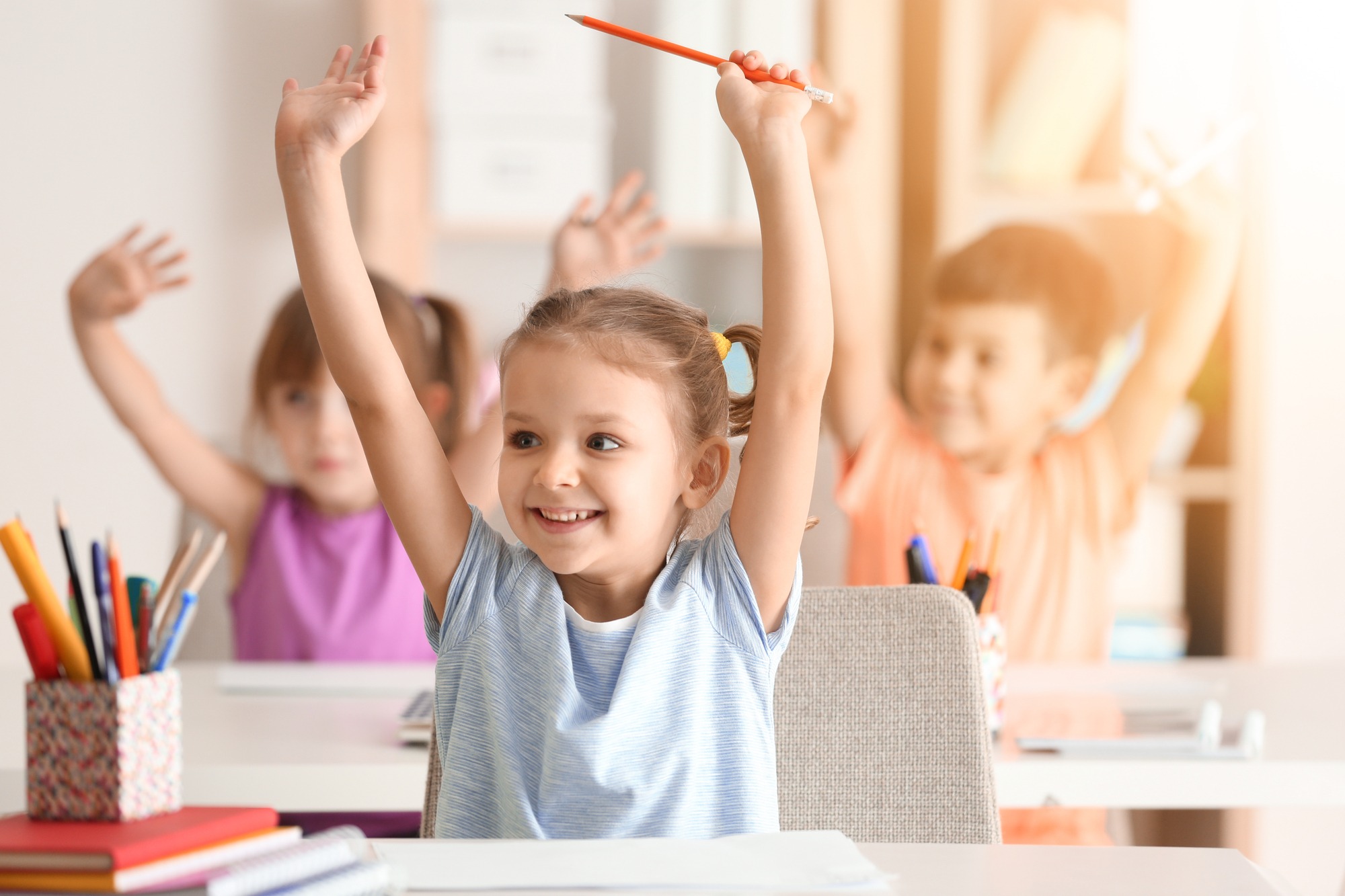 Cute girl at lesson in classroom